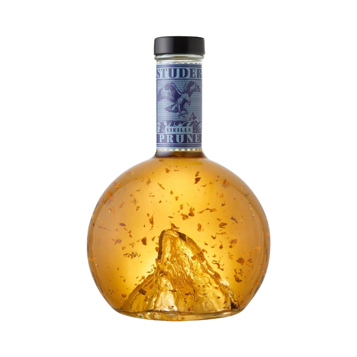 Swiss Vieille Prune mit 24 Karat Gold Flitter vor weissem Hintergrund