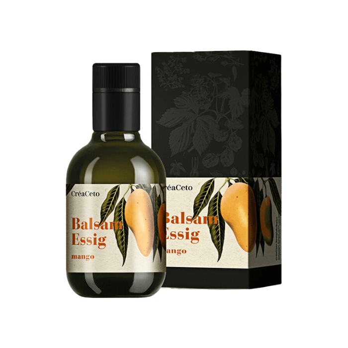 Balsam Essig Mango Flasche und Verpackung vor weissem Hintergrund.