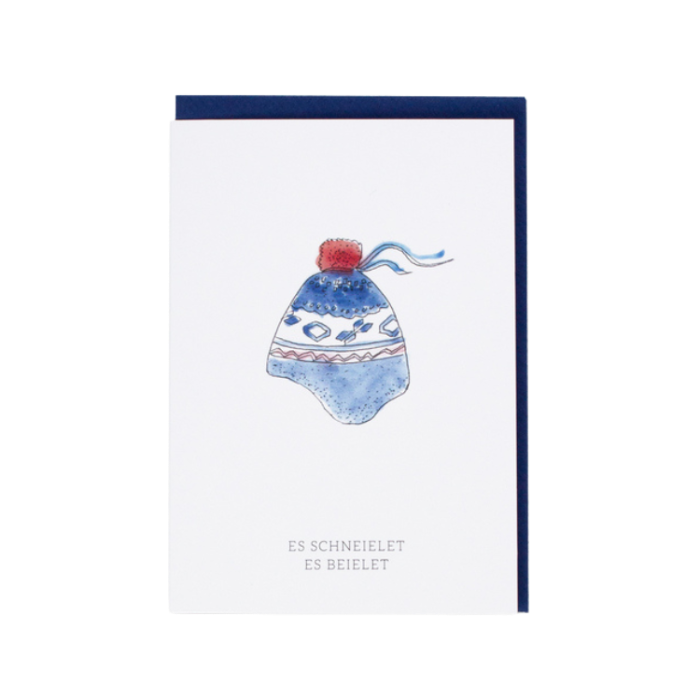 Weihnachtskarte "es schneielet es beielet" vor weissem Hintergrund