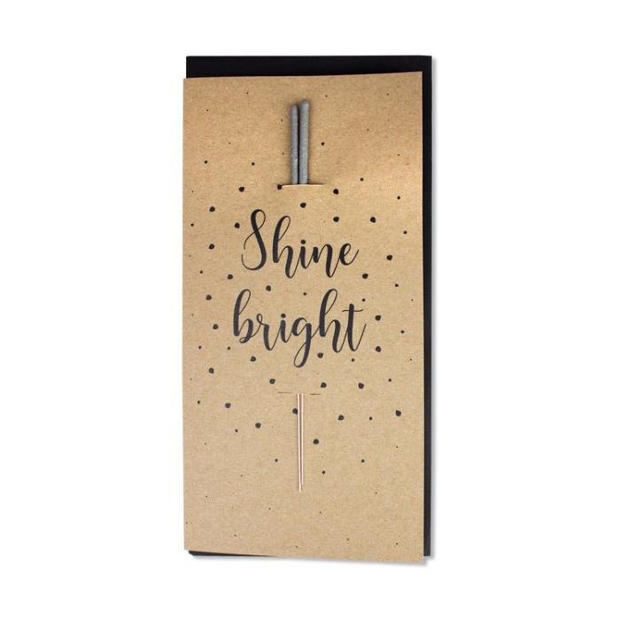 Karte Shine Bright mit Wunderkerze vor weissem Hintergrund